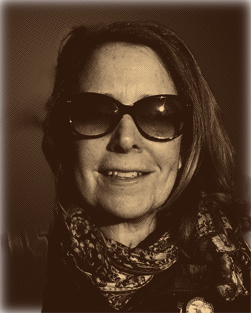Amy smiling in a classic yearbook portrait