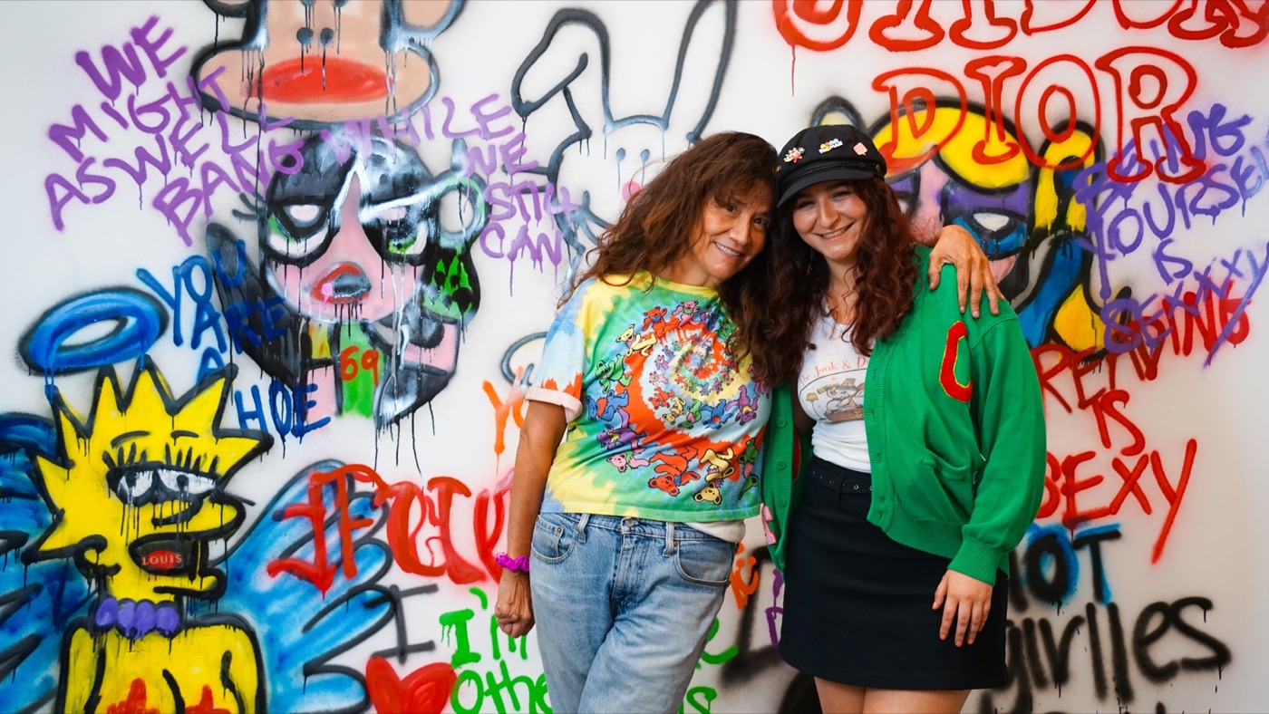 The mother and daughter founders of The Junk and Disorderly Girls smiling together at a TJDG pop up